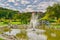 Small lake with fountain near Kaskady hotel wellness and spa resort building near Sielnica