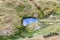 Small lake with grass around in Western Tatras mountains in Slovakia