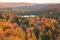 Small lake among hills and trees with fall color in northern Minnesota