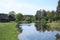Small lake on the outskirts of the Latvian farm at the end of May 2019