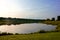 Small Lake reflection with grass shore area