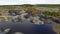 Small lake, top view. Footage. A small lake in a mountainous area. Panoramic view over the rocky mountain tops around