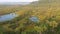 Small lakes in middle of a beautiful swamp in early autumn, marsh autumn landscape at dawn