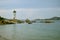 Small lighthouse at the shores of Mediterranean sea in small city of Palau