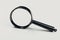 Small magnifying glass on light background, search