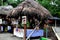 Small market with Indigenous shops with roofs made of leaves selling local handicrafts in ecuador, latin america