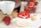 small meringue Pavlova dessert with strawberry