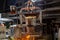 Small metallurgical ladle with molten steel moves on a hook of crane