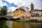 Small Mill Ditch park, restaurants and cafe on pond shore, stream with puddings, garden and historical buildings in center of
