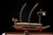 A small model of ancient Korean ironclad war ship. Korean turtle ship on a black background