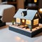 A small model of a house sits atop a table.