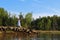 A small model lighthouse on the shore of the Wallace river in Nova Scotia on a summer evening