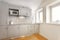 Small and modern kitchen with grey cupboards