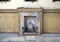 Small monument with painting of Queen Isabella I of Castile on an outside wall of a street in Granada, Andalusia, Spain.