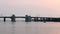 Small motor boat travelling past the Captree draw bridge at dusk