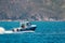 Small motorboat cruising in Hout Bay, Cape Town