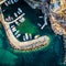 Small motorboats moored at dock, Paros island, Greece, view from above