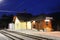 Small mountain railroad station lighted in the night