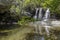 Small mountain river with a waterfall on a sunny day Greece, Andros Island, Cyclades