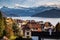 small mountain village and snowy peaks of Alps in the background