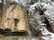 A small nameless waterfall over a travertine rock on the slopes of Mountain Rigi in a winter setting, Weggis - Canton of Lucerne