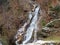 A small nameless waterfall in Weesen settlement on the shores of Lake Walen or Lake Walenstadt / Walensee - Canton of St. Gallen