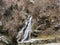 A small nameless waterfall in Weesen settlement on the shores of Lake Walen or Lake Walenstadt / Walensee - Canton of St. Gallen