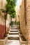Small narrow rustic street inside the old village Dalt Vila in Ibiza town