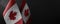 Small national flags of the Canada on a dark background
