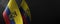 Small national flags of the Ecuador on a dark background