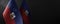 Small national flags of the Haiti on a dark background