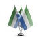 Small national flags of the Sierra Leone on a white background