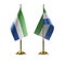 Small national flags of the Sierra Leone on a white background