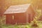 Small natural house, which is built of wood. The building is located in the forest