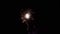 Small new year eve fireworks - glowing explosions on dark sky