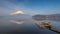 A small old boat at a port with beautiful water reflection of Fuji mountain at Yamanaka lake