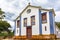 Small and old church and crucifix in colonial architecture