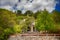 A small old church hidden among the trees of an olive grove