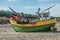 Small old colorful fishboat on a seashore