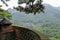 Small old monastery among mountains in China, view with barrier