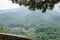 Small old monastery among mountains in China, view via fence