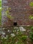 A small open alcove set into the brickwork of the old Walled Garden of Kennedy House