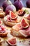 Small open sandwiches with ciabatta, proscuitto and fresh figs