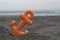 Small orange anchor beach toy