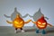 Small orange and red pumpkin with halloween face, legs and hands hold hands