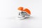 A small orange stapler isolated on a white background. Close-up. Copy space. Space for text