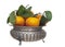 Small oranges, tangerines, with leaves in vintage pewter bowl, isolated on white.