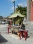 Small ornamental buddist shrine with incense sticks