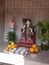 Small ornamental buddist shrine with offerings of fruit and veg