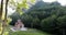 A small Orthodox church in the shadow of the forest